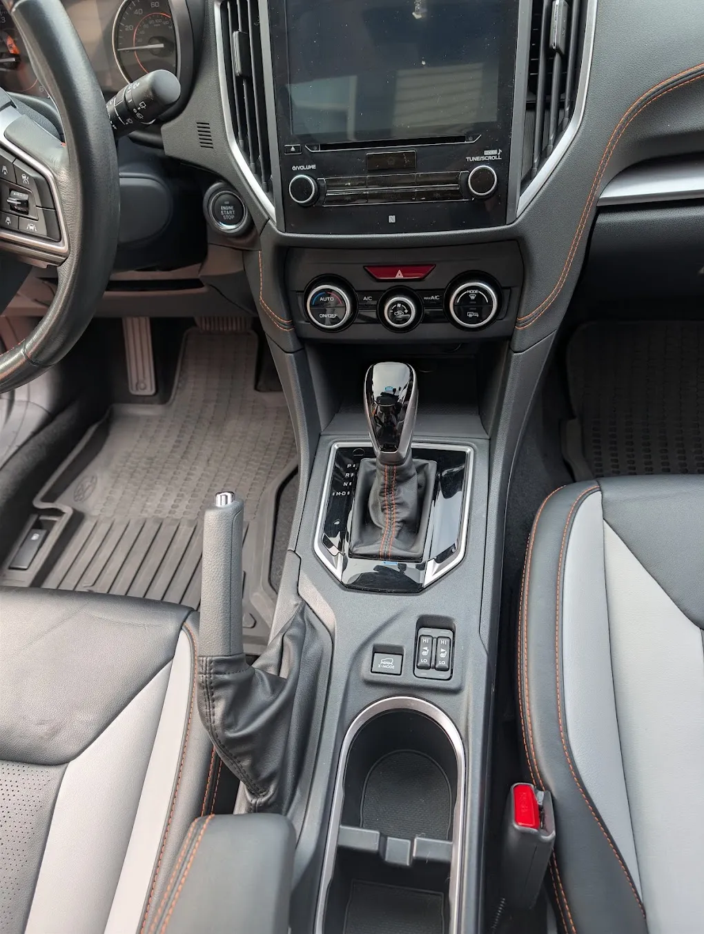 Cleaned and conditioned center console and dashboard after an interior detail by Eagle Eye Auto Detailing