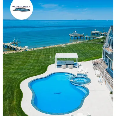 Freeform waterfront pool and hot tub installed by Patriot Pools overlooking the water near Centreville, MD